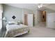Large bedroom with a view of the staircase and multiple doors at 126 Woodbury Ln, Canton, GA 30114