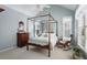 Charming bedroom features a four poster bed, vaulted ceiling and lots of natural light at 126 Woodbury Ln, Canton, GA 30114