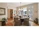 Cozy dining area featuring a round table with wicker chairs and a door to the deck at 126 Woodbury Ln, Canton, GA 30114