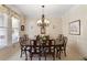 Traditional dining room featuring a large table, chandelier, and bright window at 126 Woodbury Ln, Canton, GA 30114