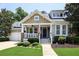 Charming home featuring a covered porch, neat landscaping, and an attached two-car garage at 126 Woodbury Ln, Canton, GA 30114