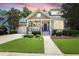 Charming home featuring a covered porch, neat landscaping, and an attached two-car garage at 126 Woodbury Ln, Canton, GA 30114