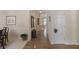 Hallway featuring hardwood floors, neutral paint, with a carpeted dining space on the left at 126 Woodbury Ln, Canton, GA 30114