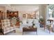 Open living space with neutral tones, bright windows and bar seating at the kitchen counter at 126 Woodbury Ln, Canton, GA 30114
