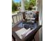 Inviting porch with wicker seating and a blue striped rug, perfect for relaxing outdoors at 126 Woodbury Ln, Canton, GA 30114