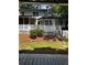 Backyard view of the deck, gazebo, screened in porch, and white picket fence at 1789 Springhouse Ct, Lawrenceville, GA 30043