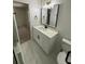 This modern bathroom has white marble floors, quartz countertop and black hardware at 1789 Springhouse Ct, Lawrenceville, GA 30043