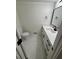 Modern powder room with white marble floors, quartz countertop and black hardware at 1789 Springhouse Ct, Lawrenceville, GA 30043