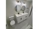 Bright bathroom features a double vanity with round mirrors and modern gold light fixtures at 1789 Springhouse Ct, Lawrenceville, GA 30043