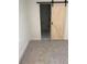 Bedroom with a view of a Primary bathroom with a sliding barn door feature at 1789 Springhouse Ct, Lawrenceville, GA 30043