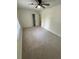 Neutral bedroom with carpet, a ceiling fan, and a white trim window at 1789 Springhouse Ct, Lawrenceville, GA 30043