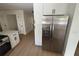 Kitchen showcasing stainless steel refrigerator and ample white cabinet space at 1789 Springhouse Ct, Lawrenceville, GA 30043