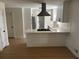 Modern kitchen showcasing white cabinets, stainless steel appliances, and light wood flooring at 1789 Springhouse Ct, Lawrenceville, GA 30043