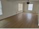 Bright living room boasts modern lighting, fresh paint, and large windows at 1789 Springhouse Ct, Lawrenceville, GA 30043
