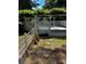 A view of the pool and white lattice gazebo with stepping stones through the grass at 1789 Springhouse Ct, Lawrenceville, GA 30043