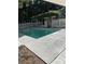 A view of the pool and white lattice gazebo showing the concrete pool deck at 1789 Springhouse Ct, Lawrenceville, GA 30043