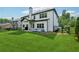 Large, newly sodded backyard with a covered porch and black fence at 236 Lakestone Pkwy, Woodstock, GA 30188