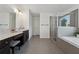 A spacious bathroom has double sinks, vanity, and a large glass enclosed shower at 236 Lakestone Pkwy, Woodstock, GA 30188
