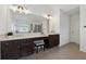 Bathroom with large mirror, double sinks, vanity, and stone countertops at 236 Lakestone Pkwy, Woodstock, GA 30188