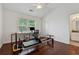 Bright home bedroom featuring hardwood floors, pilates machine, and natural light at 236 Lakestone Pkwy, Woodstock, GA 30188