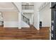 Bright foyer featuring hardwood floors, a staircase, and elegant trim work at 236 Lakestone Pkwy, Woodstock, GA 30188