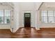 Spacious foyer with hardwood floors, natural light, and elegant door trim at 236 Lakestone Pkwy, Woodstock, GA 30188
