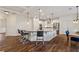 Open concept kitchen with large island, stainless steel appliances, and pendant lighting at 236 Lakestone Pkwy, Woodstock, GA 30188