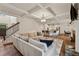 Stylish living room featuring a coffered ceiling, hardwood floors, and an open floor plan at 236 Lakestone Pkwy, Woodstock, GA 30188