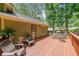 Inviting back deck with a table and chairs, great for enjoying the outdoors at 269 Powder Mill Dr, Dallas, GA 30157