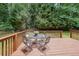 Enjoy this back deck and enjoy the surrounding nature from this wooden platform with a dark stain at 269 Powder Mill Dr, Dallas, GA 30157
