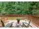 Relax on the spacious back deck with seating and enjoy serene views of the lush greenery at 269 Powder Mill Dr, Dallas, GA 30157