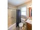 Clean bathroom features a shower and tub combo, toilet, vanity, and a window for natural light at 269 Powder Mill Dr, Dallas, GA 30157