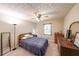 Cozy bedroom features neutral walls, carpeted floors, ceiling fan, and natural light from the window at 269 Powder Mill Dr, Dallas, GA 30157