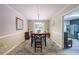 Elegant dining room featuring a wooden table, stylish chairs, and access to the backyard at 269 Powder Mill Dr, Dallas, GA 30157