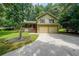 Charming home boasts a two-car garage, well-maintained lawn, and a cozy front porch at 269 Powder Mill Dr, Dallas, GA 30157