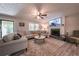 Comfortable living room with fireplace, large sectional, and neutral décor at 269 Powder Mill Dr, Dallas, GA 30157