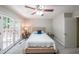 Cozy main bedroom featuring a large bed and French doors to the outside deck at 269 Powder Mill Dr, Dallas, GA 30157