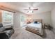 Spacious main bedroom with French doors to a deck and neutral color scheme at 269 Powder Mill Dr, Dallas, GA 30157