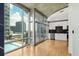 Modern kitchen with white cabinets, stainless appliances, and city view at 923 Peachtree Ne St # 932, Atlanta, GA 30309