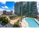 Community pool deck with lounge chairs and umbrellas at 923 Peachtree Ne St # 932, Atlanta, GA 30309
