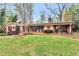 Charming single-story brick home with a lush green lawn and mature trees in a desirable neighborhood at 2994 Baker Ridge Nw Dr, Atlanta, GA 30318