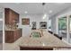 Modern kitchen with stainless appliances, including wall oven, and a center island featuring a double sink at 2994 Baker Ridge Nw Dr, Atlanta, GA 30318