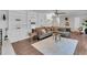 Spacious living room features built-in shelving, hardwood floors, and plenty of comfortable seating at 2994 Baker Ridge Nw Dr, Atlanta, GA 30318