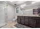 Bathroom features a double sink vanity, updated shower, and neutral color palette at 9055 Green Valley Ct, Douglasville, GA 30134