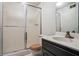 Bathroom with sink, toilet, and a shower with sliding glass doors at 9055 Green Valley Ct, Douglasville, GA 30134