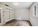 Bedroom features hardwood floors, built-in bookshelves, and ample natural light at 9055 Green Valley Ct, Douglasville, GA 30134
