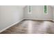 Bright bedroom features hardwood floors and modern windows offering natural light and inviting atmosphere at 9055 Green Valley Ct, Douglasville, GA 30134