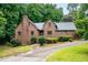 Lovely brick home showcasing a charming facade with a well-maintained lawn and mature landscaping at 9055 Green Valley Ct, Douglasville, GA 30134