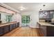 Kitchen featuring modern appliances, granite countertops, and wood floors, perfect for cooking and entertaining at 9055 Green Valley Ct, Douglasville, GA 30134