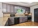 Kitchen features stainless steel appliances, and a stylish backsplash, perfect for culinary enthusiasts at 9055 Green Valley Ct, Douglasville, GA 30134